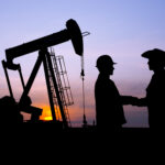 Oil Worker and Rancher Farmer Cooperating at Pumpjack